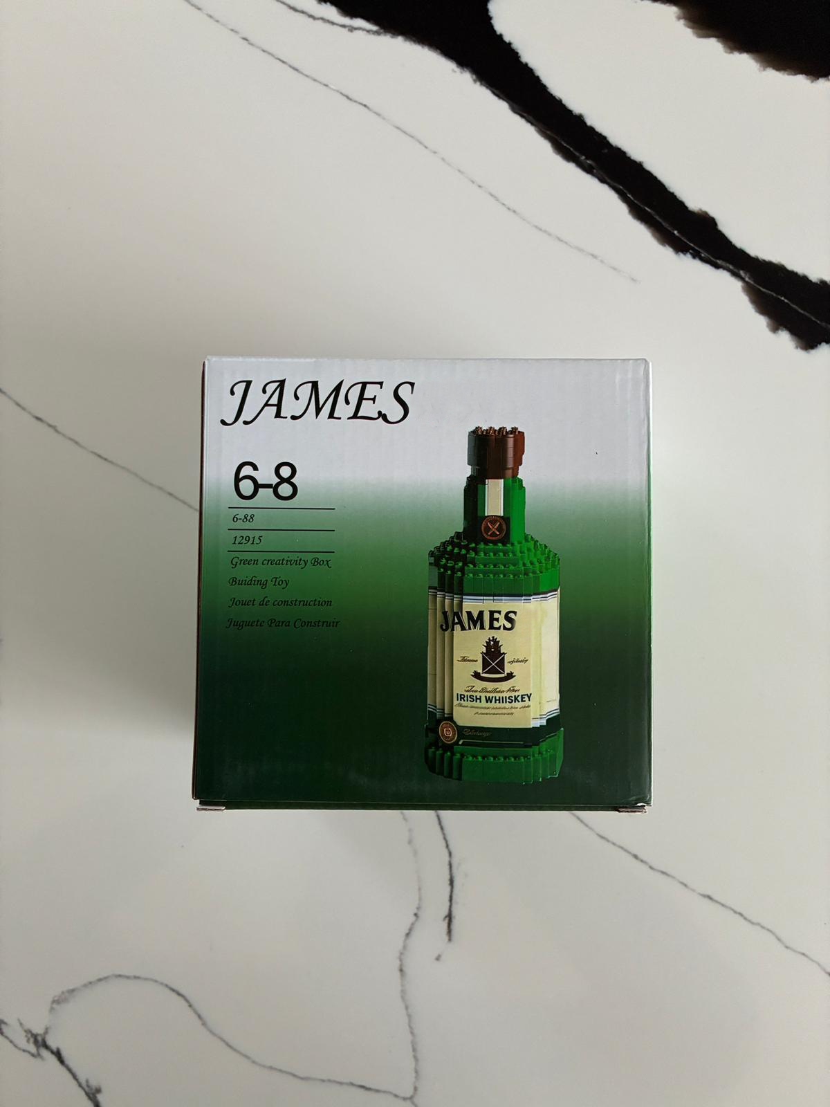 James Premium Green Bottle building block model displayed on shelf and desk